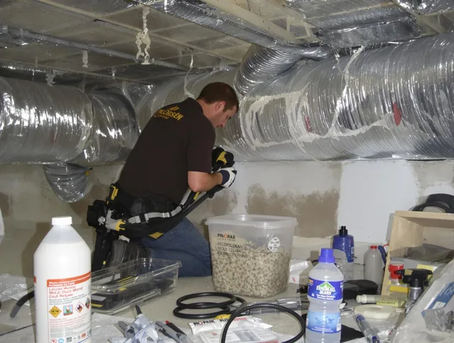 Pembroke Air Duct Cleaning specialist performing professional mold removal from air ducts in Pembroke