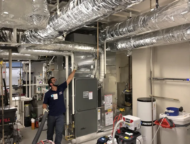 Pembroke Air Duct Cleaning specialist performing thorough furnace duct cleaning in a Pembroke residence