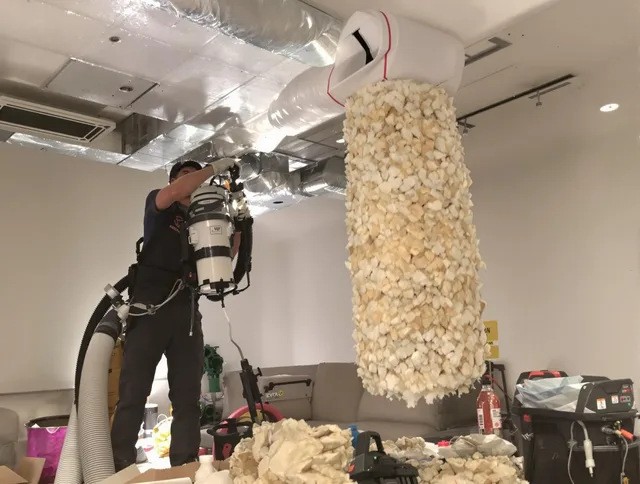 Pembroke Air Duct Cleaning technician performing precision vacuum insulation removal in a residential property in Pembroke