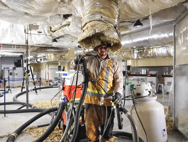 Professional vacuum insulation removal by Pembroke Air Duct Cleaning expert in Pembroke